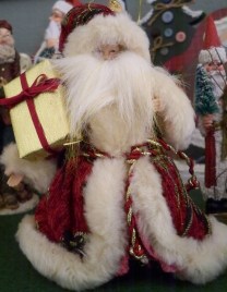 This guy has a wonderful burgundy and goal paisley coat. And his beard is so fluffy it covers his whole face.